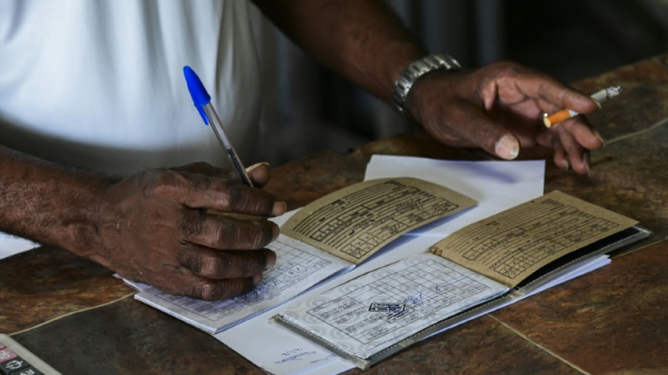 Cuban ration book, symbol of the revolution, gathers dust