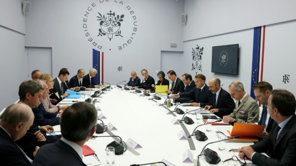 Macron warns of Russian 'hybrid' threat after meeting presidential hopefuls