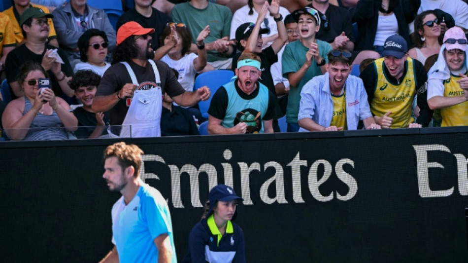 Exhausted Wawrinka battles on in Melbourne farewell after five-set epic