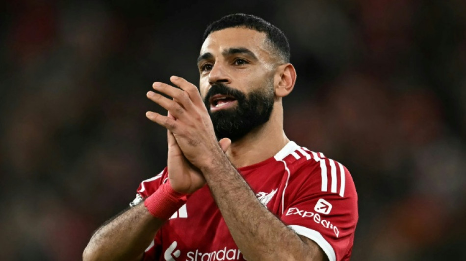 Salah back in Liverpool fold as Arsenal grab last-gasp win