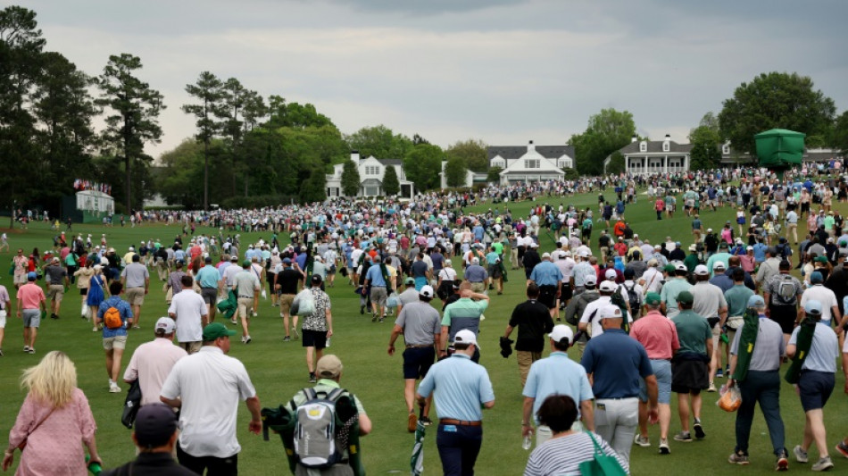 Masters play resumes after brief suspension for bad weather