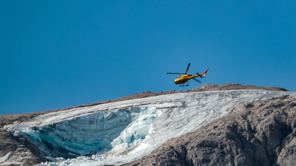 Rescuers gather body parts after Italy glacier collapse