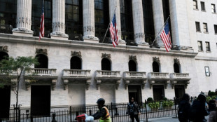 Wall Street termine h&eacute;sitante, plut&ocirc;t dans le rouge, avant un discours de la Fed