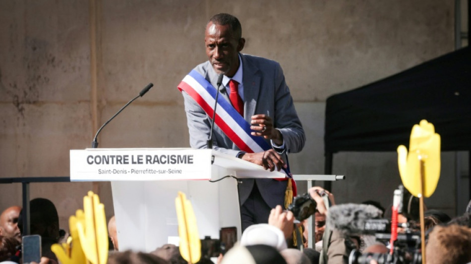 Thousands rally against racism in Paris suburb to defend mayor